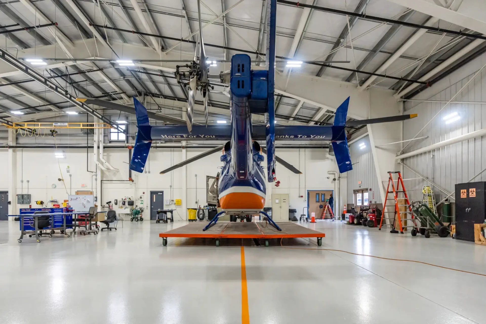 Seamless commercial epoxy resin floor in an aircraft hangar installed by Legacy Industrial Coatings